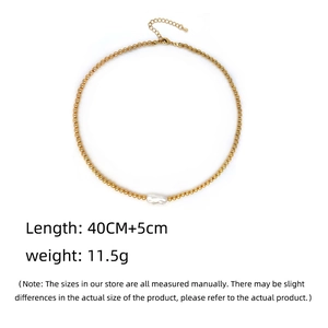 Detail of bohemian gold-plated bead chain featuring an irregular natural freshwater pearl