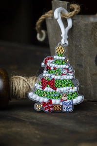 Detail of Christmas tree diamond painting keychain with colorful rhinestones on wood