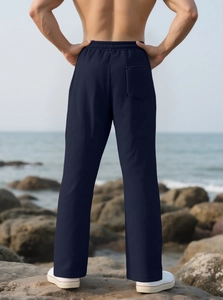 Close-up of dark blue striped texture on casual trousers with rear pocket detail