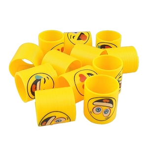 Yellow plastic spring toys with diverse emoji faces for stress relief and fun