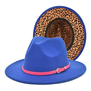 Detail of royal blue fedora hat with pink leather band and leopard print lining