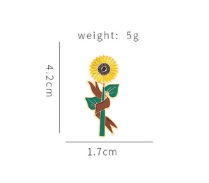 Detail of sunflower enamel pin with dimensions 4.2cm by 1.7cm and weight of 5g