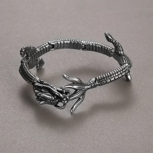 Macro shot of 18k plated stainless steel dragon bracelet focusing on scales and head