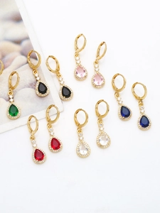Detailed close-up of colorful pear-cut zircon teardrop dangle earrings in gold finish