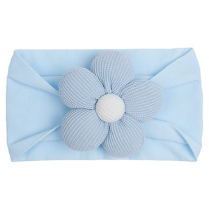 Detail of light blue baby nylon headband with large ribbed knit flower decoration