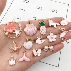 Pink and white enamel charms with gold metal frames in various cute shapes for DIY jewelry