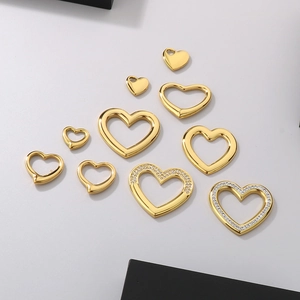 Selection of golden heart pendants in solid, hollow, and diamond-set designs for jewelry