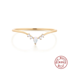 Detail of V-shaped S925 sterling silver ring with teardrop opal and sparkling diamonds