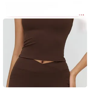 Detail of cross-waist yoga pants and longline sports vest for tummy control effect