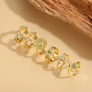 Set of six gold adjustable Evil Eye rings with enamel and rhinestones on stone base