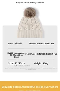 Detail of white cable knit beanie with faux fur pom pom and 54-61cm circumference size info