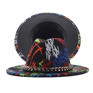 Detail view of black graffiti fedora hat with golden chain and artistic colorful patterns