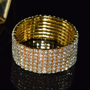 Exaggerated wide gold multi-row stretch bracelet with sparkling crystal rhinestones