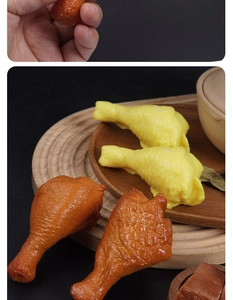 Macro detail of 1:1 realistic PVC chicken drumstick model with glossy food texture