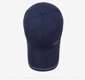 Detail of navy blue quick-dry baseball cap featuring white SPORTS text and breathable mesh fabric