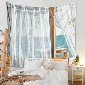 Detail of bohemian tapestry featuring a coastal window view and tropical palm leaves