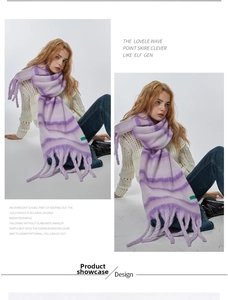 Detail of purple striped soft knit scarf with long decorative tassels on the ends
