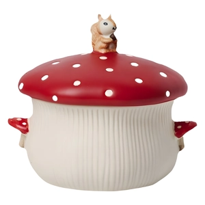 Cute mushroom-shaped ceramic storage jar with red polka dot lid and a tiny squirrel top