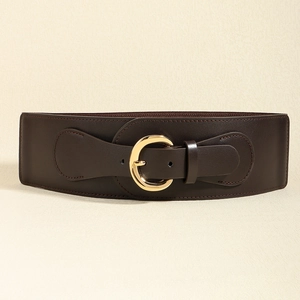 Detail of a dark brown faux leather wide belt with a metallic gold C-shape buckle