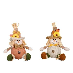 Harvest festival scarecrow dolls with maple leaves and sunflowers for fall decor