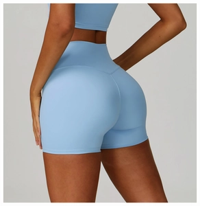 Detailed back view of light blue high-waisted yoga shorts with butt-lifting seam design