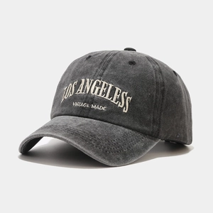 Detail of embroidered Los Angeles text on vintage charcoal washed cotton baseball cap