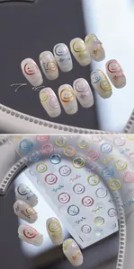 Macro detail of 3D embossed smiley face nail stickers with metallic textures and smile text