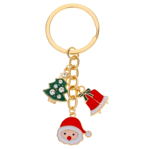 Detail of gold Christmas keychain with rhinestone tree, red bell and Santa charms