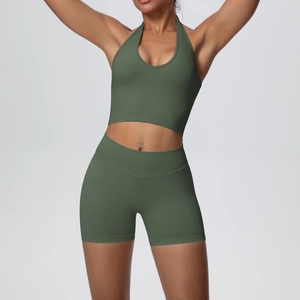 Detail of seamless ribbed high-waisted shorts and halter neck sports bra in olive green