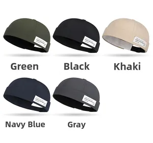 Detail view of Miki hats in five colors with Pursuit and Rebellious woven label