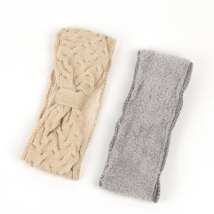 Detailed view of beige cable knit and grey plush thermal headbands for winter