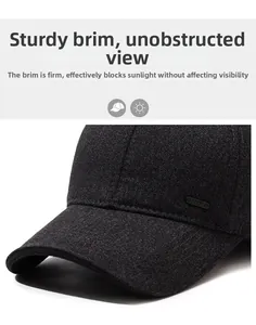 Detail of grey wool baseball cap showing the sturdy curved brim and sport metal badge