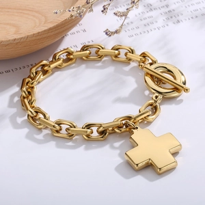 Detail of 18K gold stainless steel chain bracelet with cross pendant and OT toggle clasp