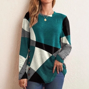 Women's long sleeve tunic top with geometric color blocks and side button details