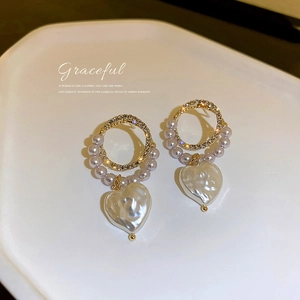 Elegant gold pearl heart earrings with sparkling rhinestones and baroque style pendants