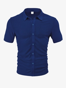 Close-up of knit texture and inner collar label on navy short sleeve polo shirt