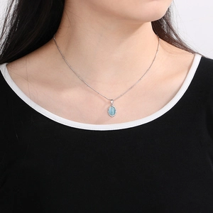 French vintage stainless steel necklace with blue cat eye stone pendant worn by model