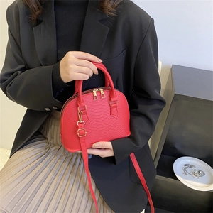 Classic red crocodile pattern shell handbag with gold hardware for women's crossbody wear