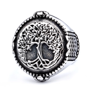 Macro shot of silver Tree of Life ring with vintage engraving and blackened textures