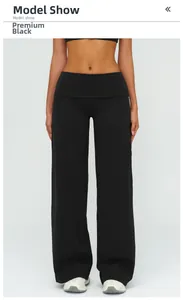 Détail du pantalon de yoga noir à taille haute et jambe large avec contrôle du ventre