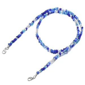 Close-up of blue and white beaded chain with silver lobster clasps for masks or glasses
