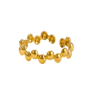 Detailed macro view of the polished golden beaded bubble texture on the adjustable open ring