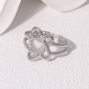 Minimalist silver star ring with hammered metal texture and adjustable open band