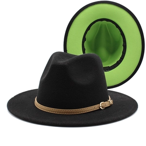 Detail of wool fedora showing black exterior contrast with vibrant green inner lining