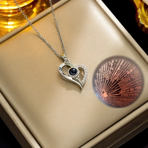 Silver heart necklace with 100 languages I Love You projection stone on gold gift box