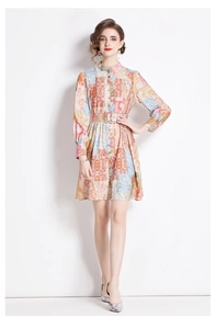 Detail of vintage paisley print dress featuring mandarin collar and matching waist belt