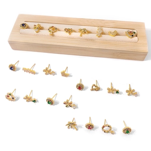 Golden stud earrings set with colorful cubic zirconia in heart and flower shapes