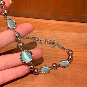 Minimalist chain necklace featuring light blue crystals and silver beads for women