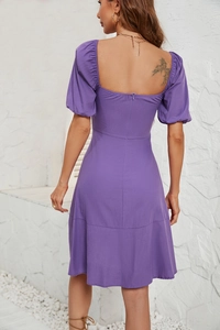 Detail view of purple puff sleeve dress with cinched waist and back zipper closure