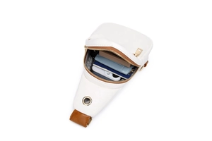 Internal view of a white leather crossbody bag showing large capacity for essentials